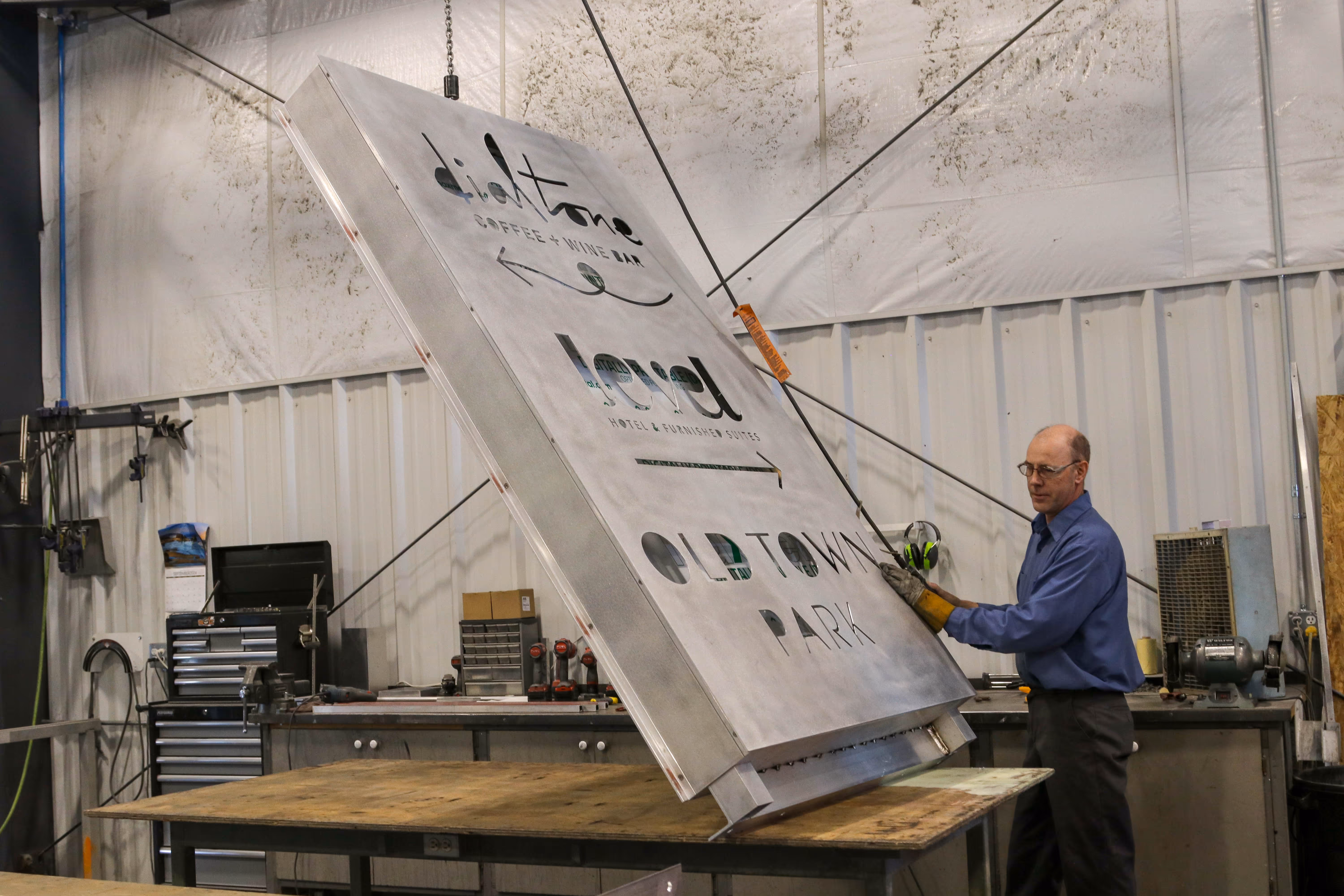 stratford sign co worker working hard on a sign project