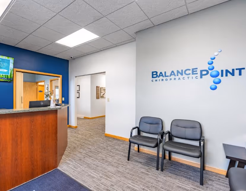 A Balance Chiropractic office with two chairs and a counter.