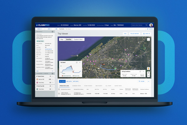 Laptop screen displaying a trip viewer dashboard with a map showing route details, trip speed graph, and driving conditions.