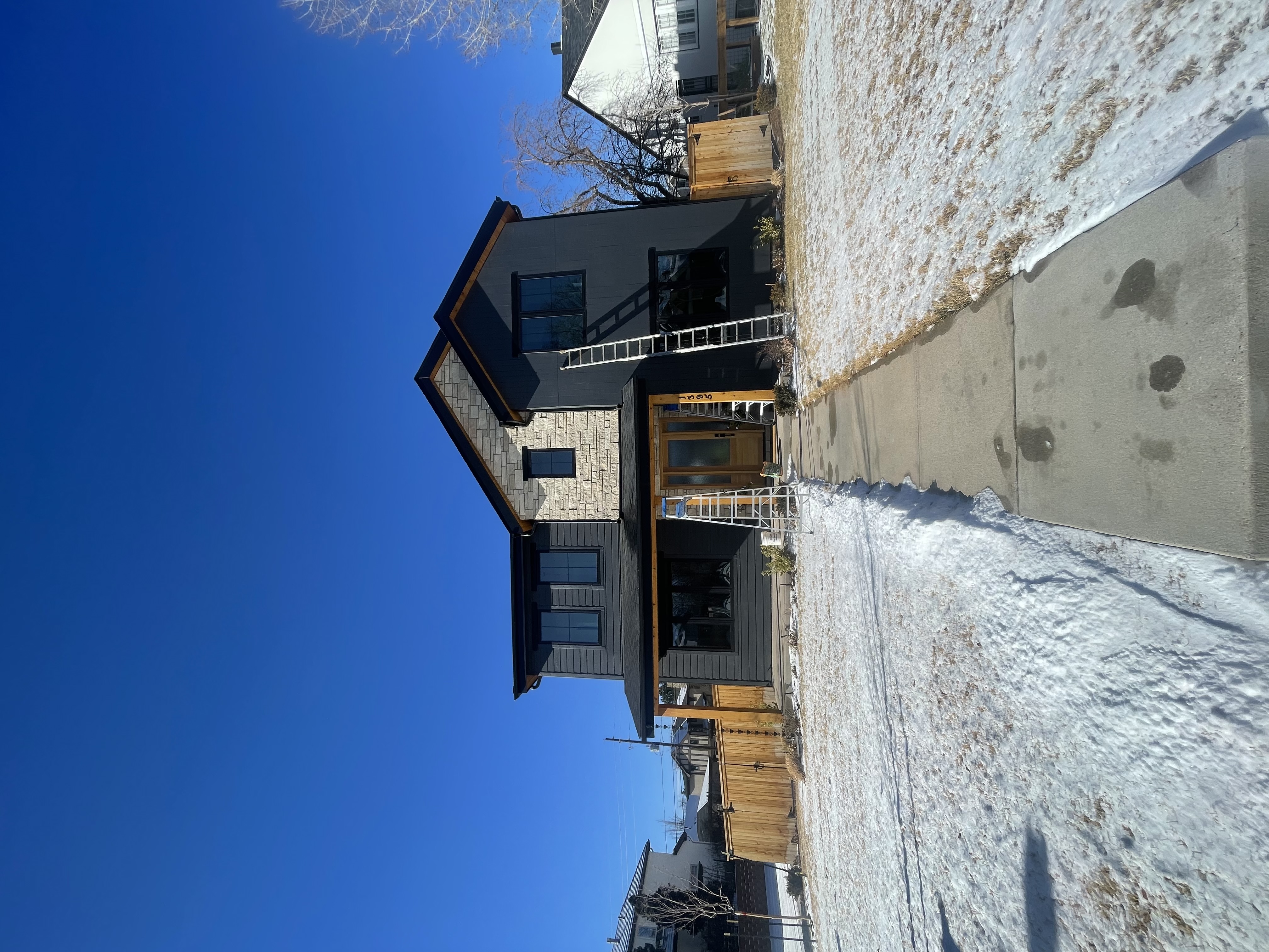 A two story home in a final construction phase in Cory Merrill with freshly cleaned windows