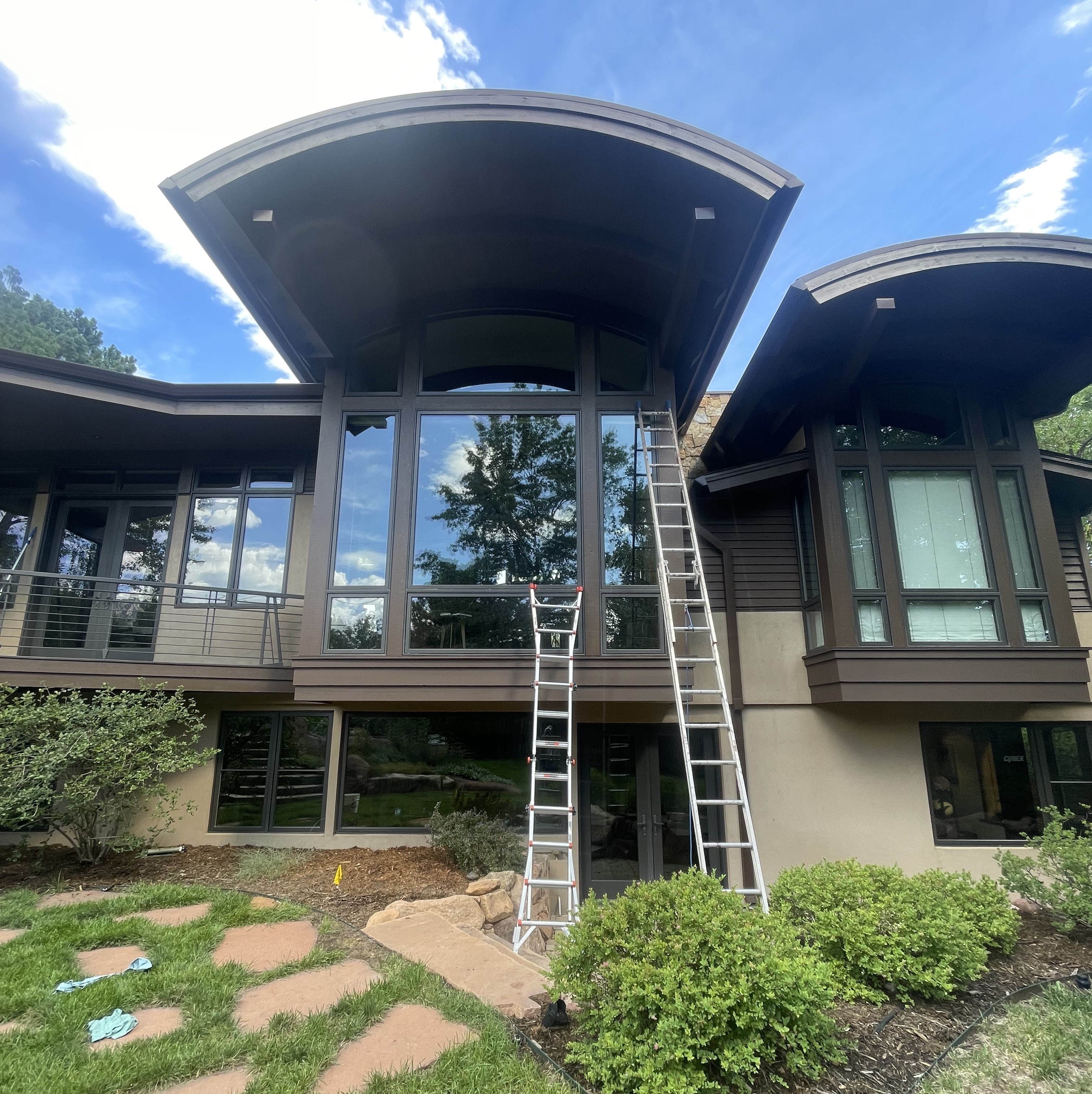 Residential window cleaning technician cleaning interior glass