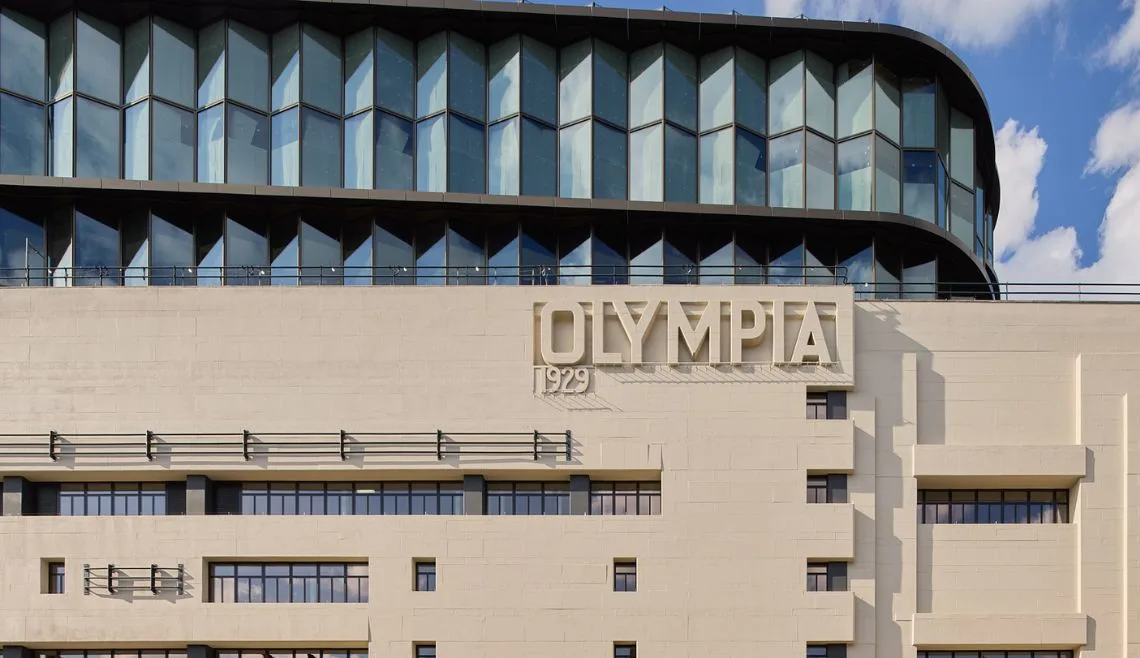 Olympia façade with Olympia 1929 engraved into stone exterior