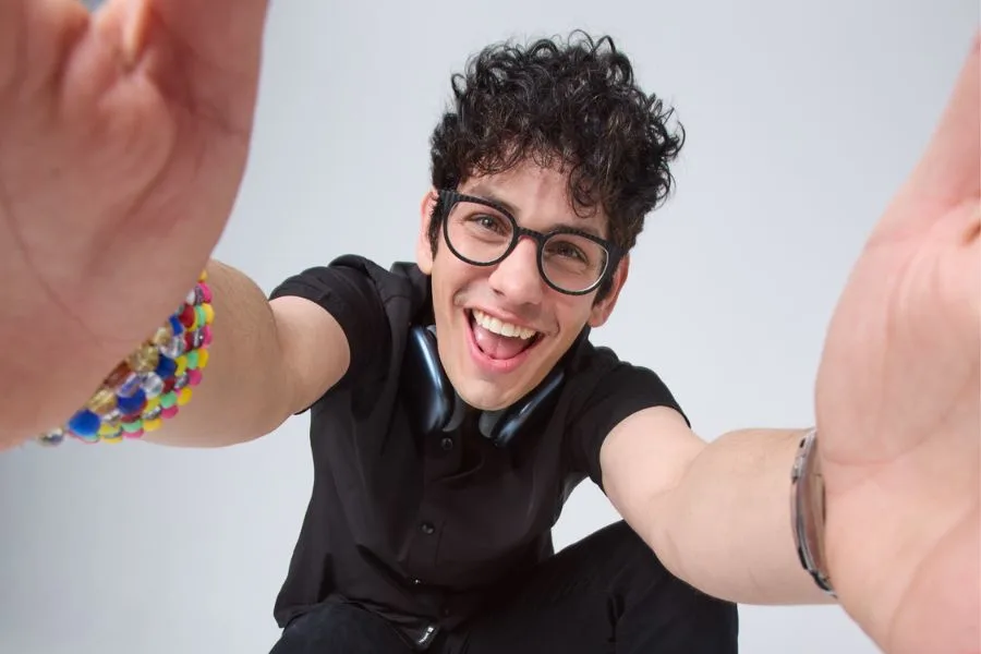 Image of Matt Bennett with hands extended towards camera.