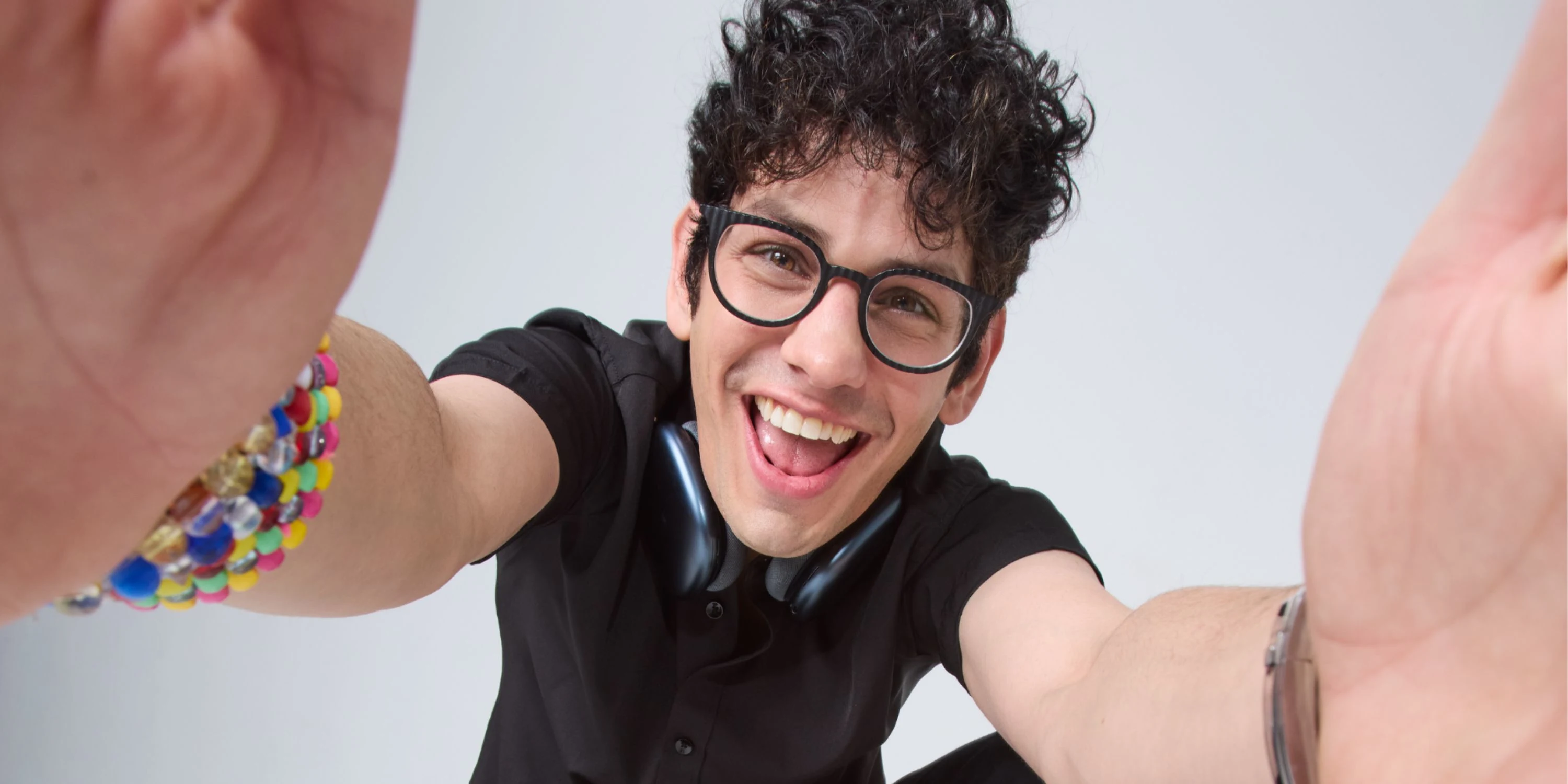Image of Matt Bennett with hands extended towards camera.
