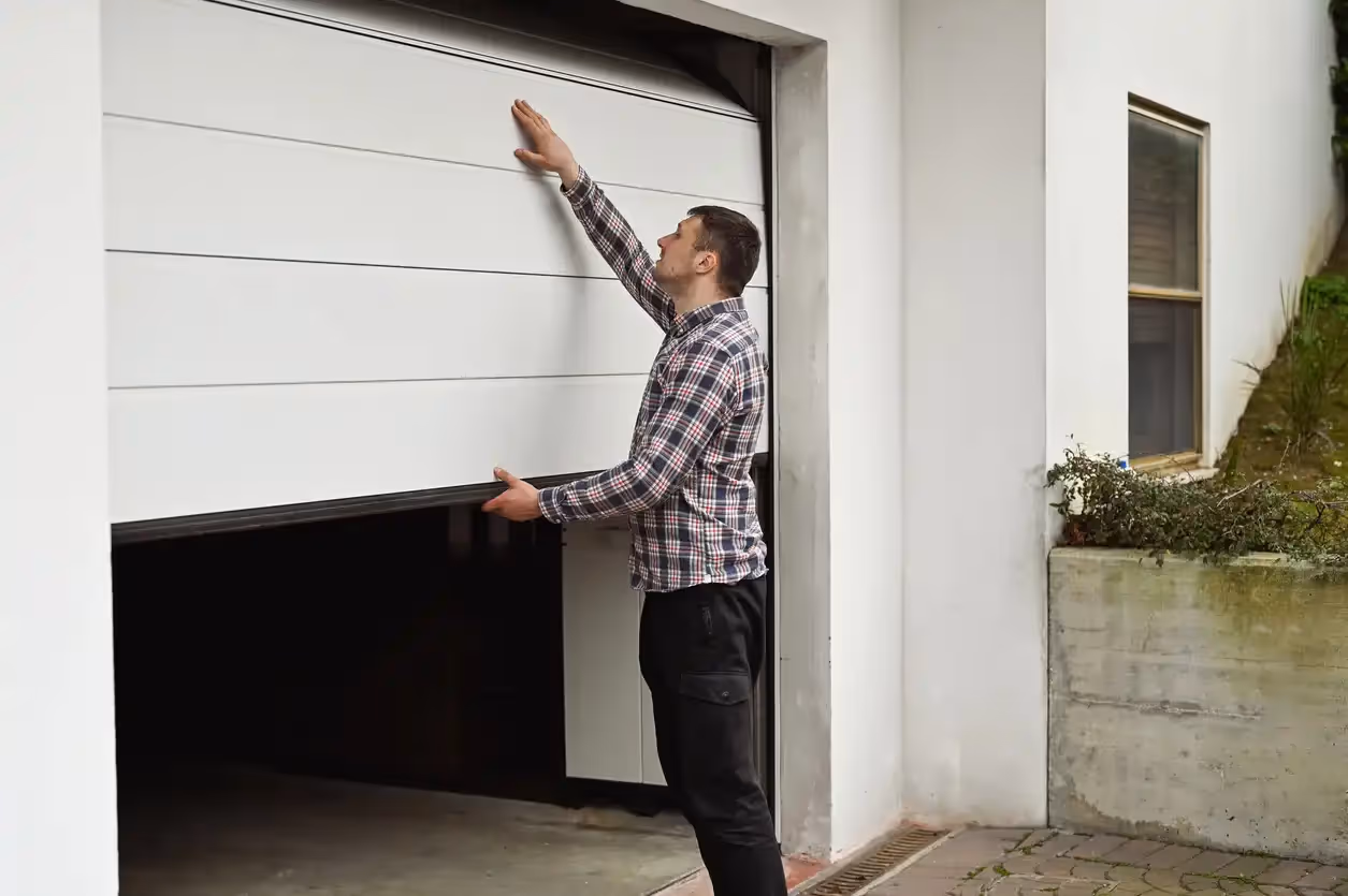 Technician working on garage sealing