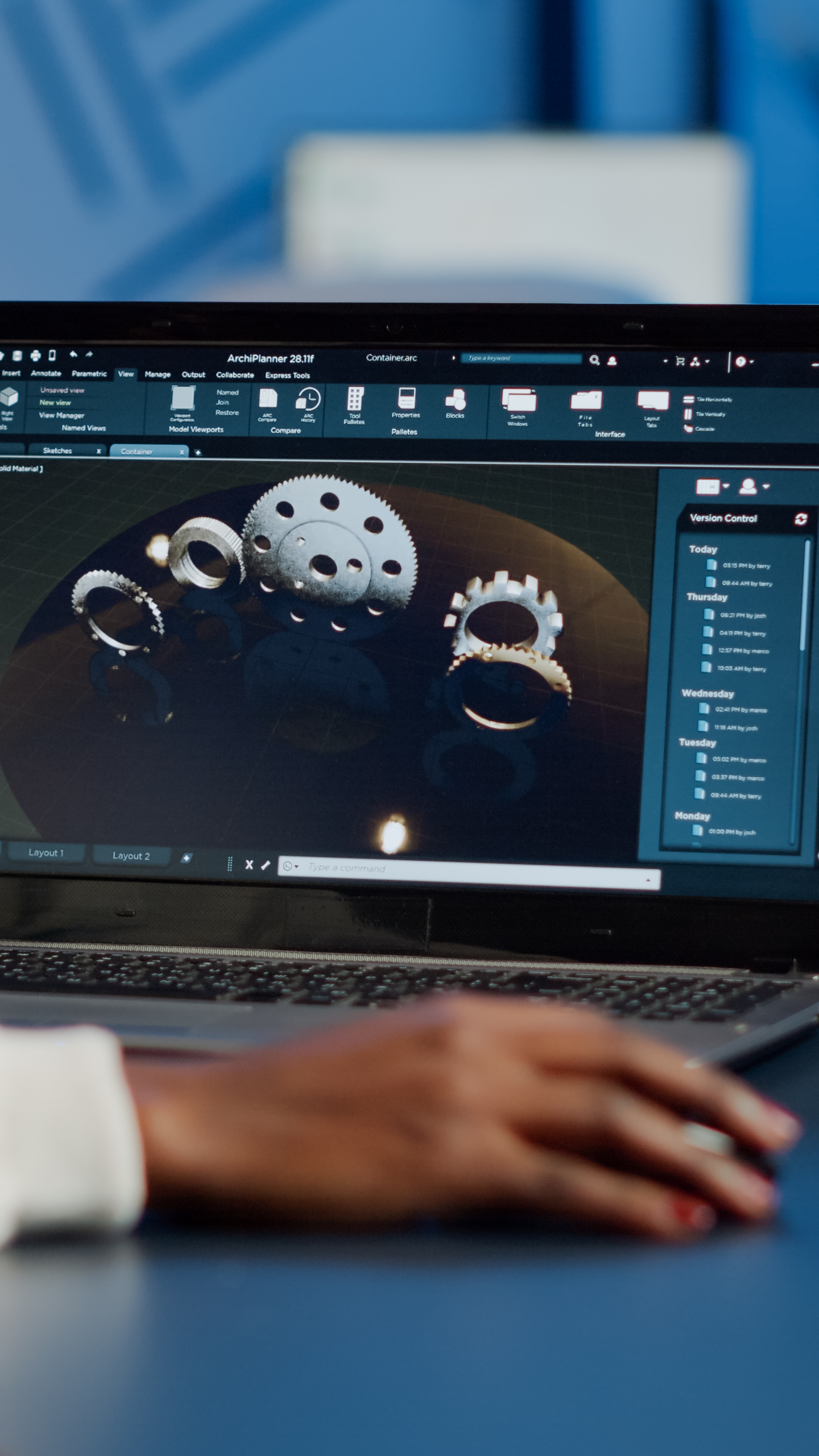 [background image] image of a dimly lit workspace with a computer showing code (for a ai fintech company)