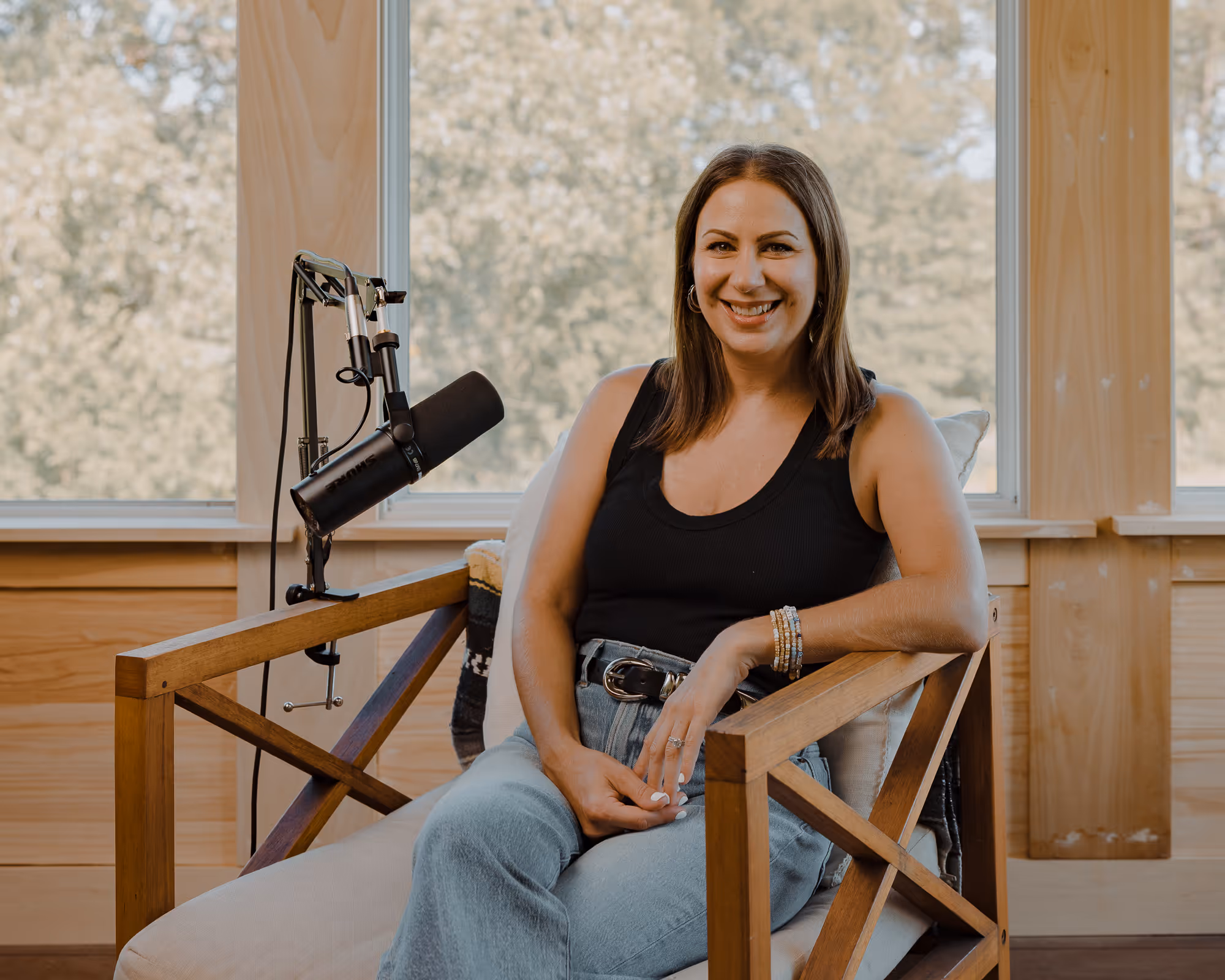 woman sitting having a podcast