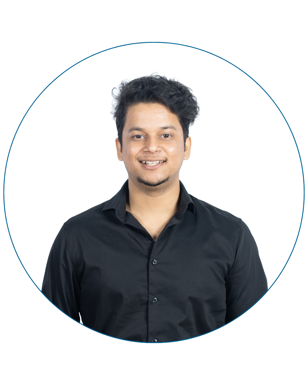 Smiling young man with dark curly hair wearing a black button-up shirt against a white background.