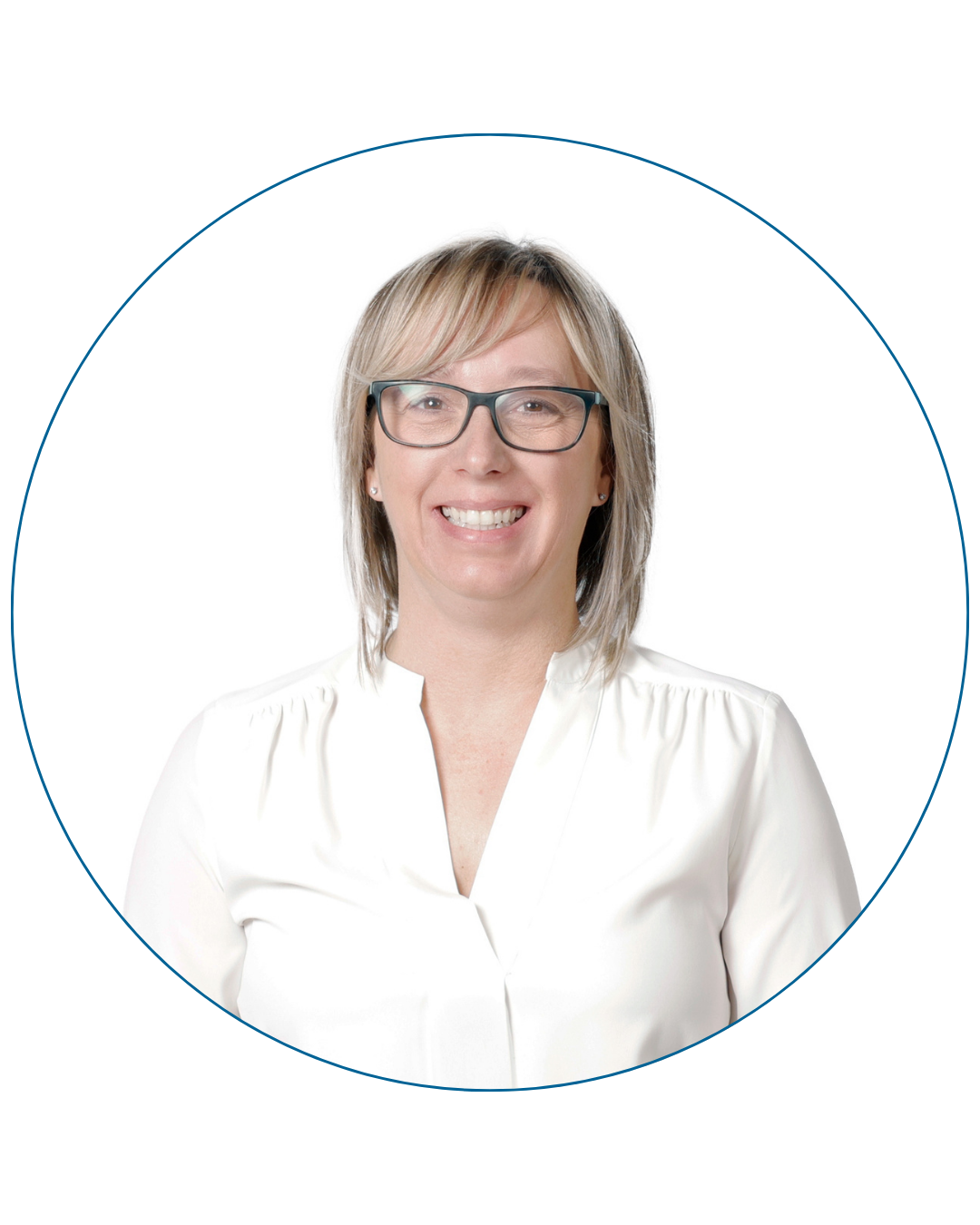 Smiling woman with blonde hair and glasses wearing a white blouse against a white background.
