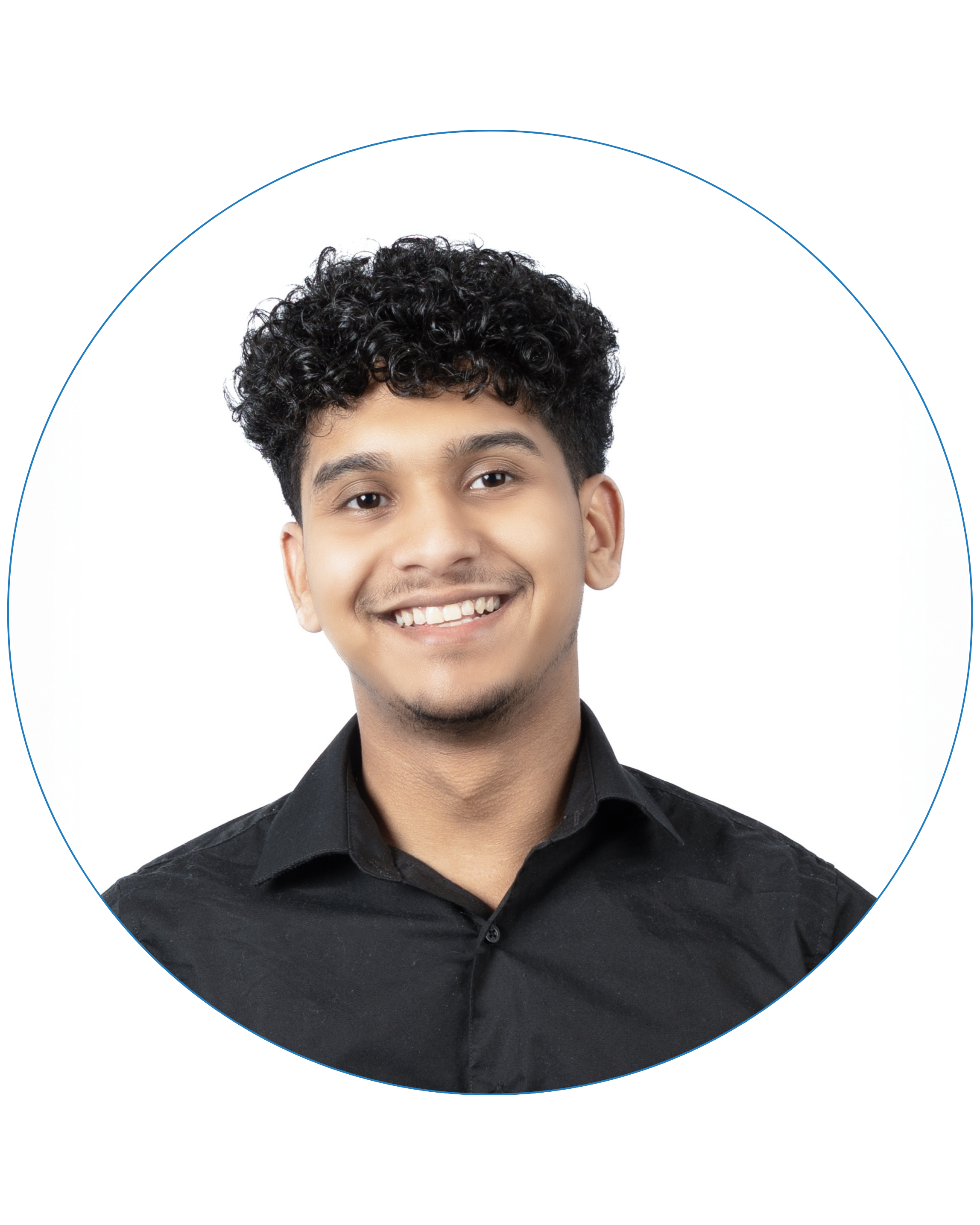 Smiling young man with curly hair wearing a black shirt against a white background.