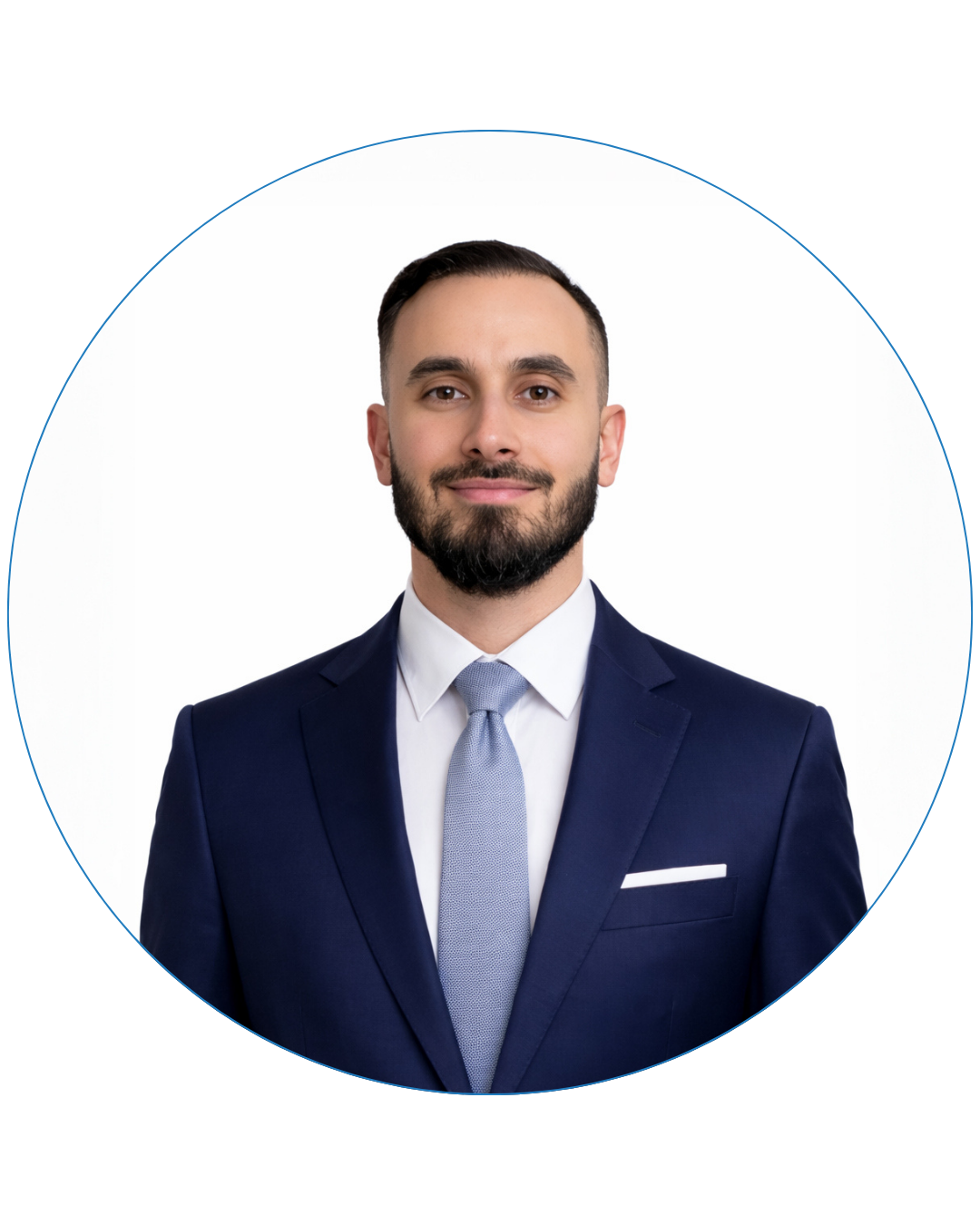 Smiling man with dark hair and beard wearing a navy suit, light blue tie, and white shirt against a white background.