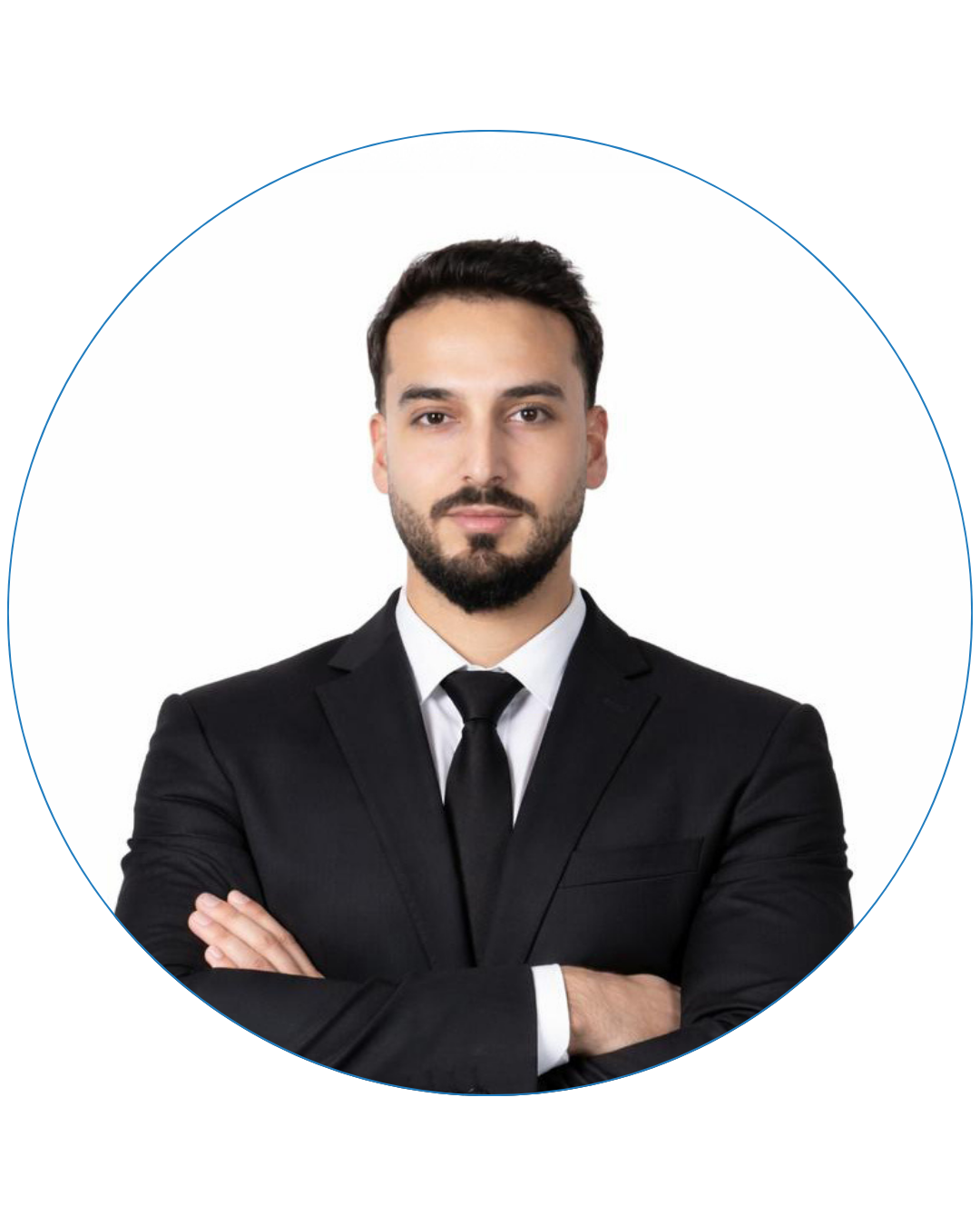 Confident man with beard wearing a black suit and tie, arms crossed, on white background.