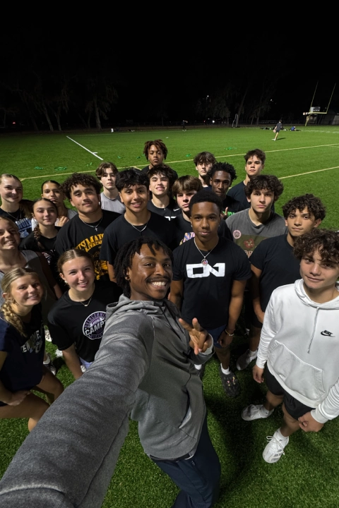 A group of young people poses for a photo on a soccer field at Mega Athletics in Fish Hawk, FL.