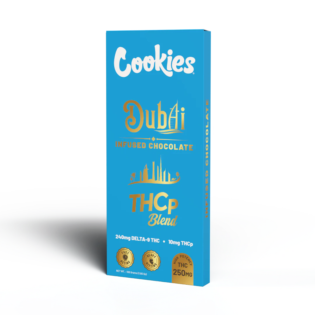 Step into luxury with the Cookies Dubai THCP Blend Chocolate Bar, a decadent 100g slab of infused indulgence crafted for those who demand more from their edibles. Featuring a potent 250mg total cannabinoid blend – including 10mg THCP and 240mg Delta-9 THC – this bar delivers an elevated, full-spectrum experience that’s both smooth and powerful.