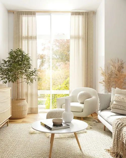 Beautiful golden-lit room with art, furniture, and plant