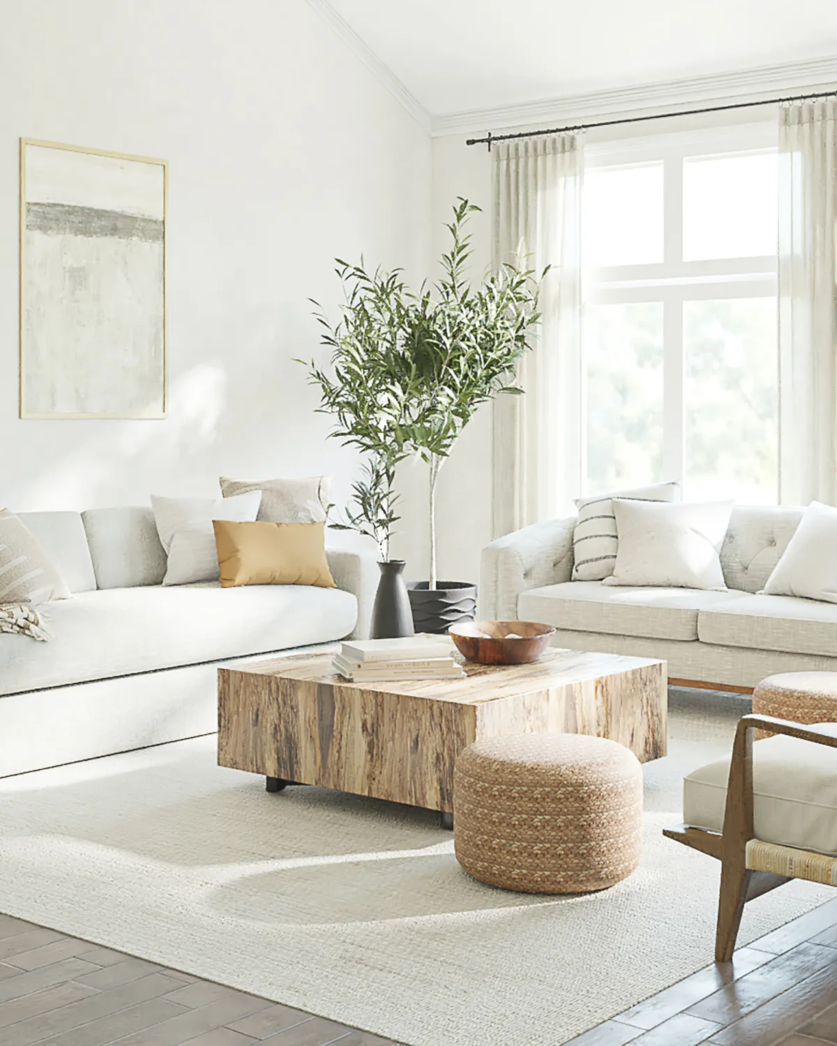 Living room with large window, sofa, and center plant