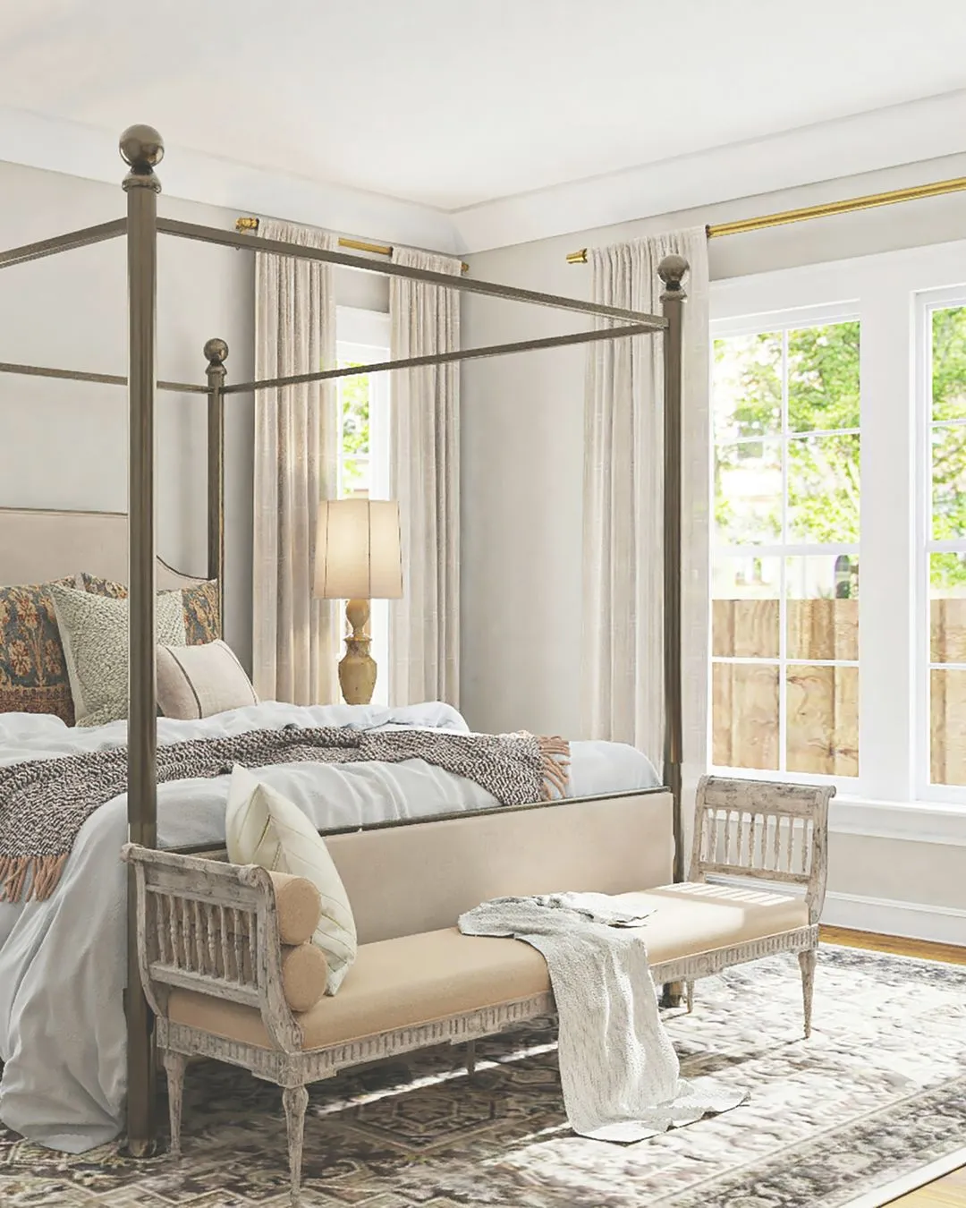 Bedroom with large windows and four-poster bed