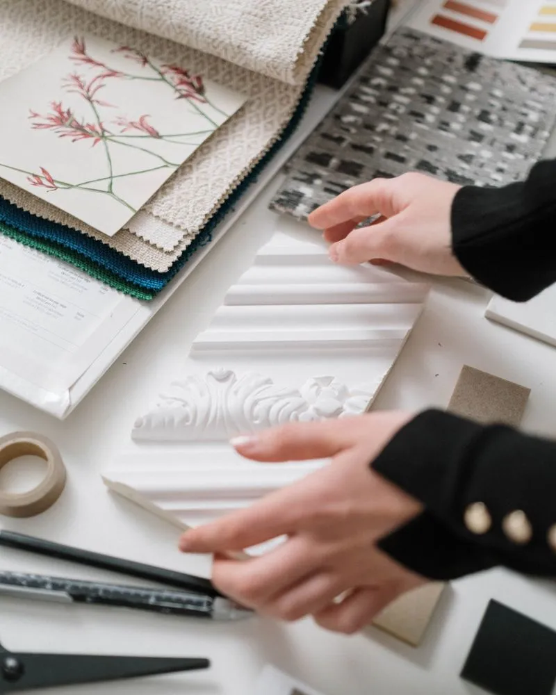 Interior designers hands touching selections