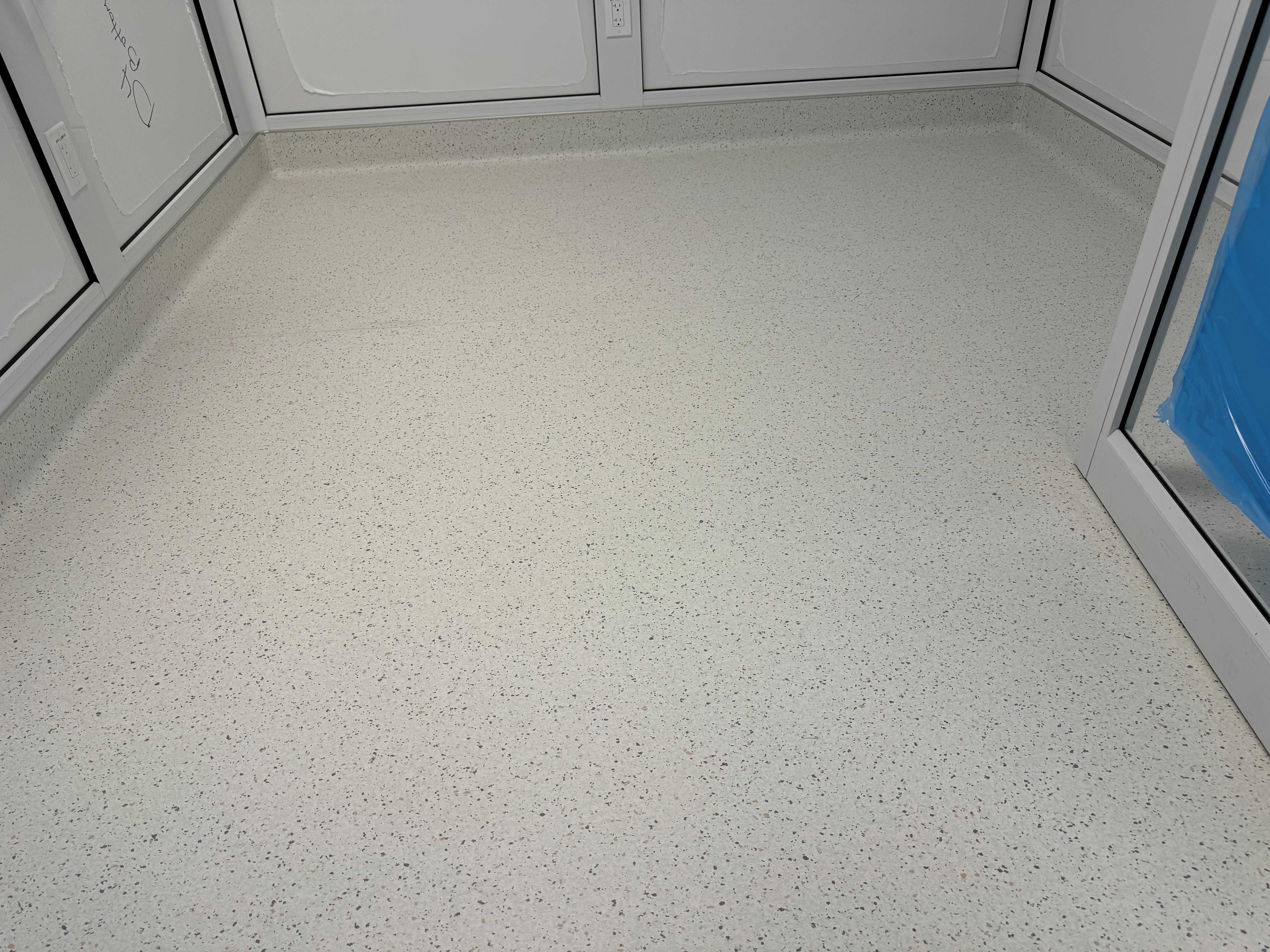 Seamless sheet vinyl flooring installation in a Houston medical cleanroom, providing hygienic, durable, and easy-to-clean surface for healthcare environments.