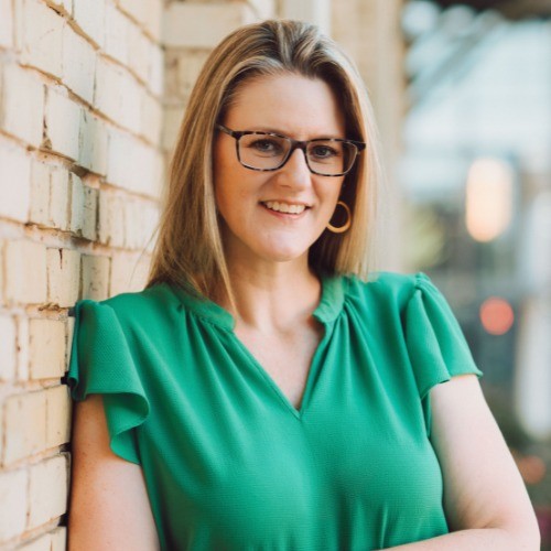 Headshot of Shawn Renee Persons, medium blonde hair with glasses
