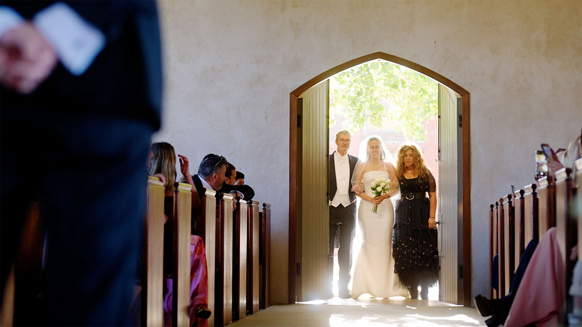 Bride walking down the aisle at wedding ceremony