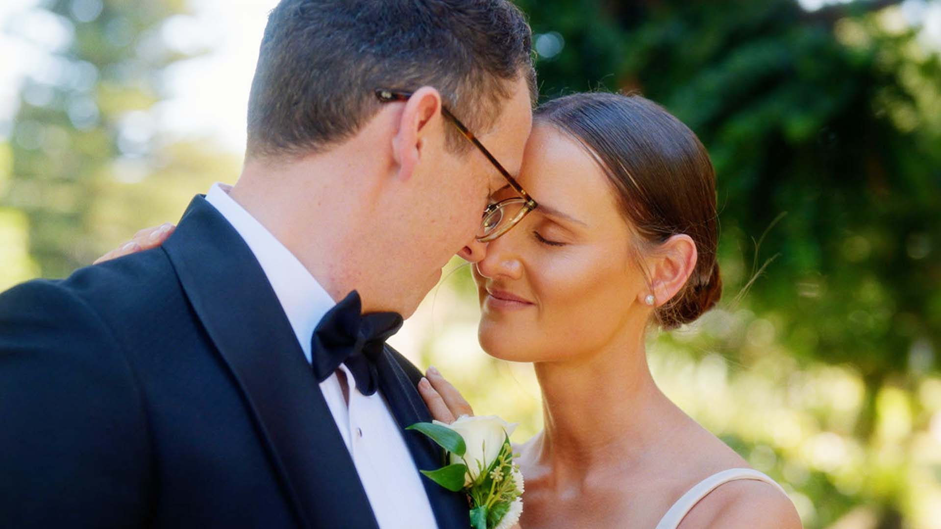 bride and groom share intimate moment at their wedding