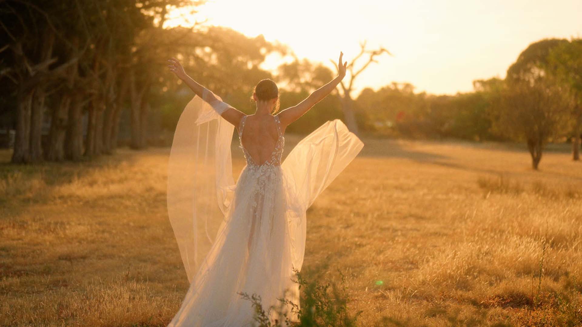 bride in her wedding dress with sunset during wedding