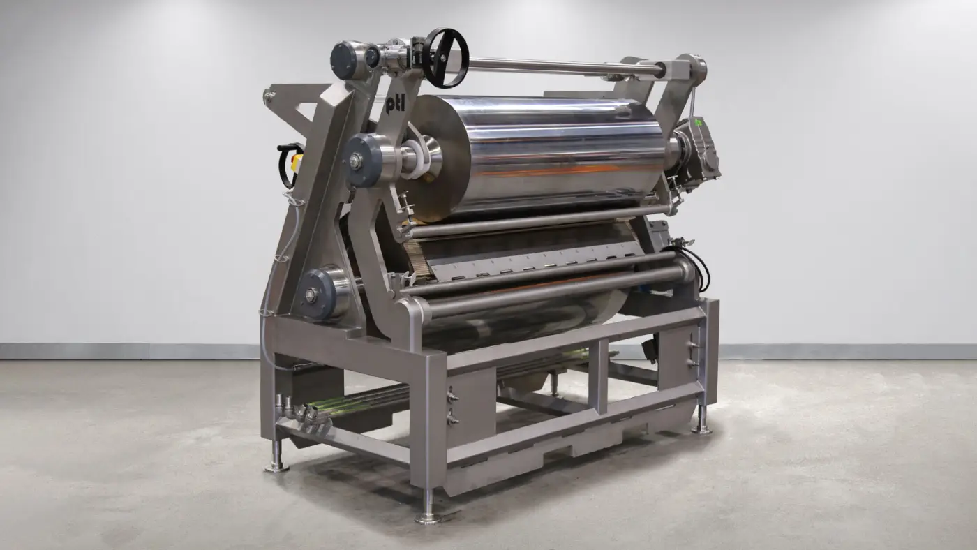 A large metal machine with a silver metal roller.