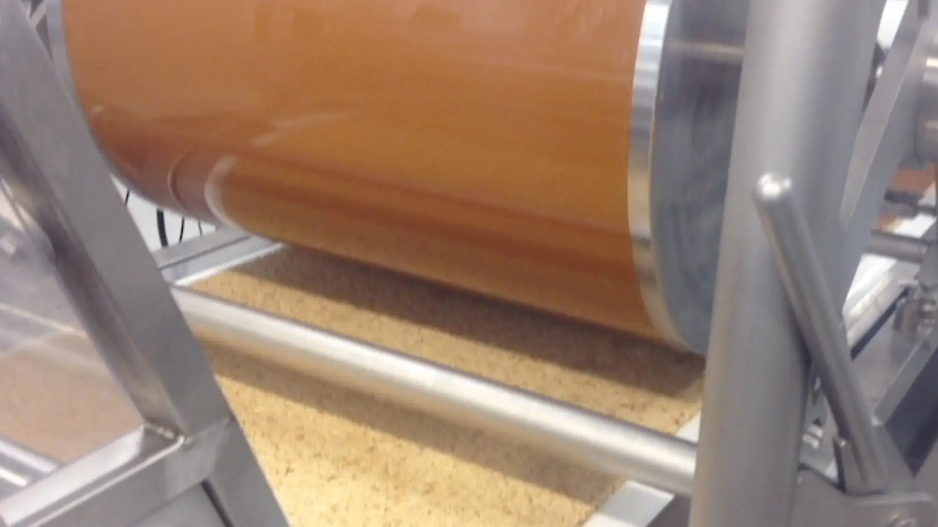 A roll of paper with a brown liquid inside.