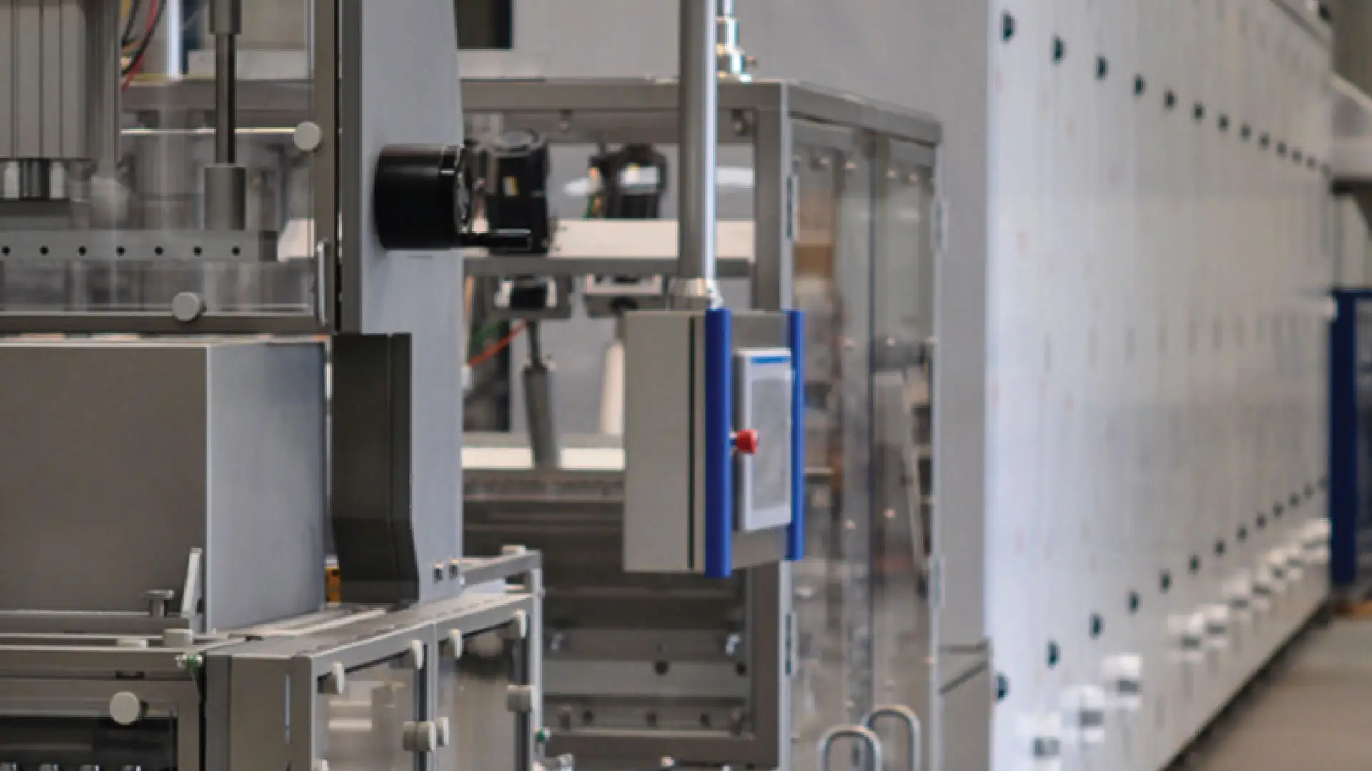 Industrial machinery with motors, panels, and mechanical components in factory