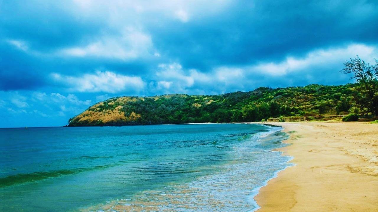 The curving golden sand shore of An Hai Beach on Con Dao Island.