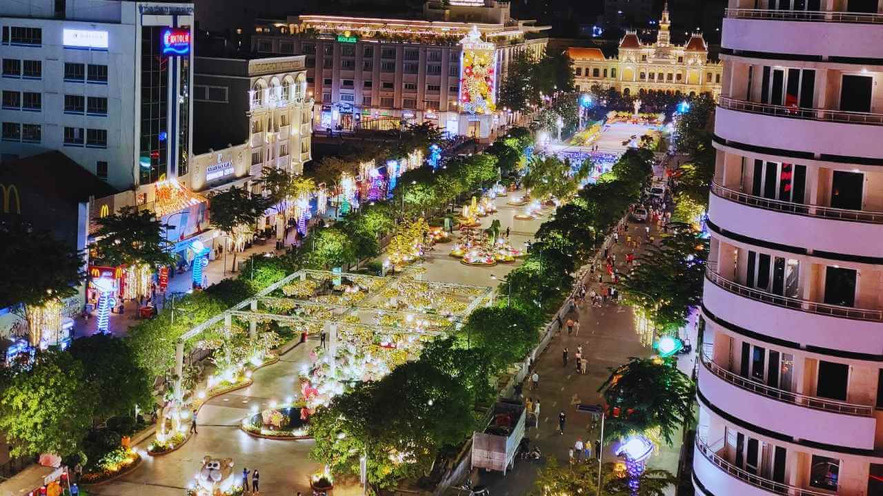 An elevated view of the lively Nguyen Hue Walking Street, the heart of Ho Chi Minh City nightlife.