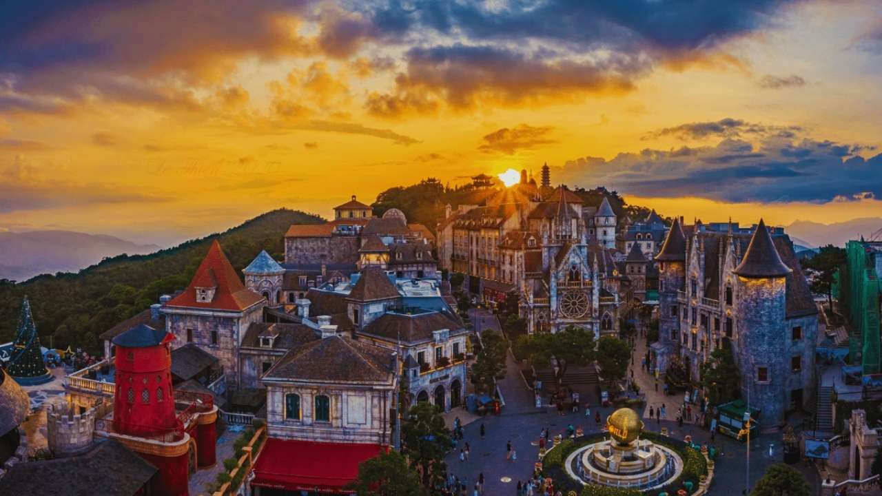 A golden sunset over the enchanting French Village at Ba Na Hills, Da Nang.