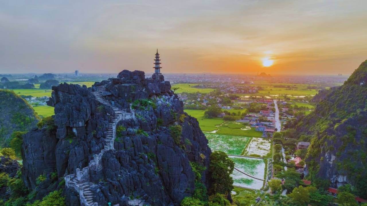 The pagoda atop Mua Cave's 500 steps with a stunning sunset view of Ninh Binh.