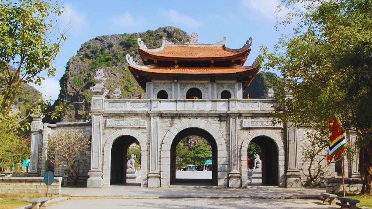 The historic stone entrance gate to Hoa Lu Ancient Capital in Ninh Binh.