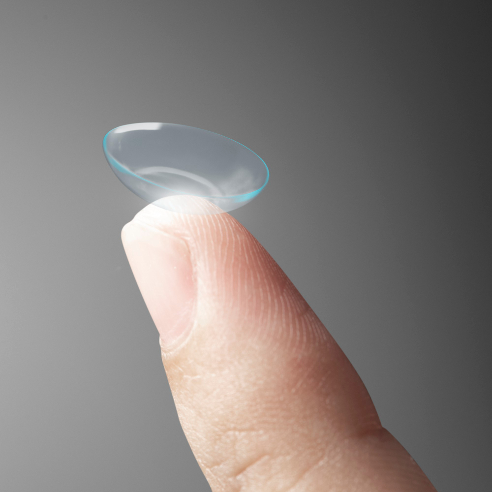 Women Holding Contact Lens