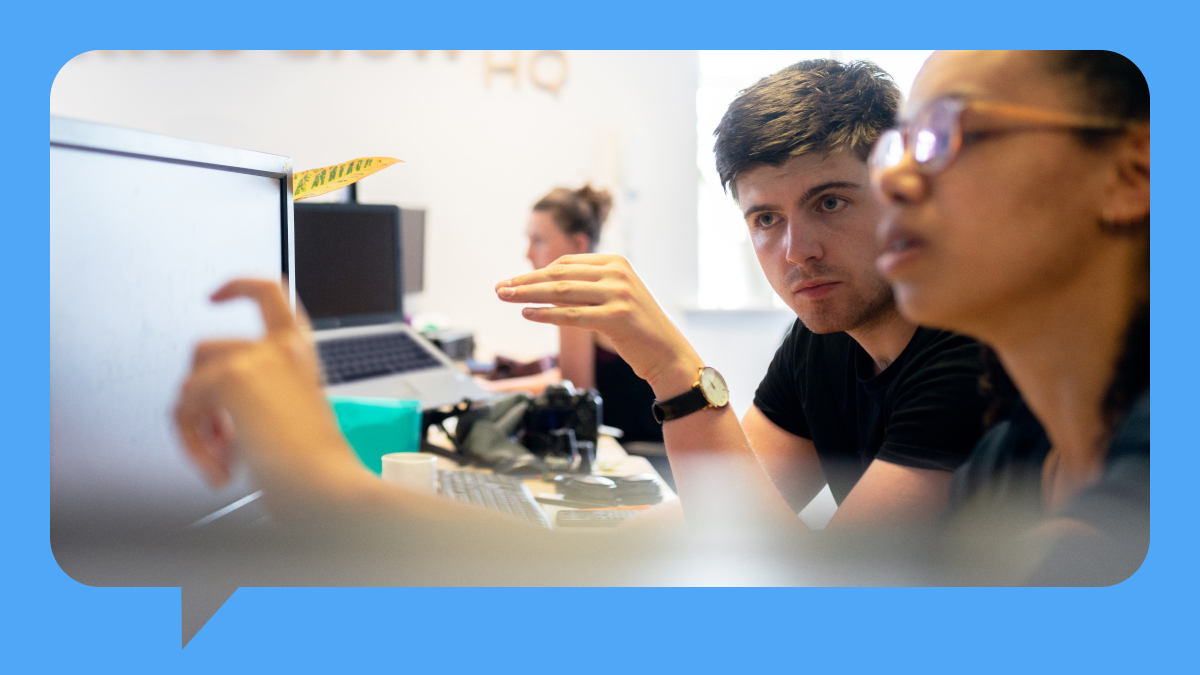 IT compliance team collaborates on a computer