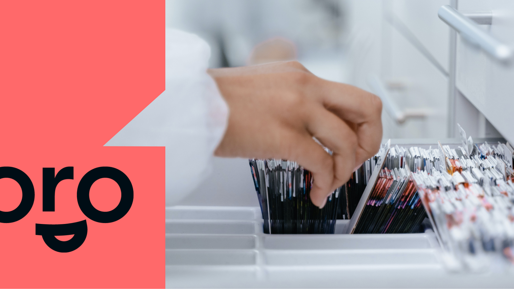 An employee thumbs through medical files