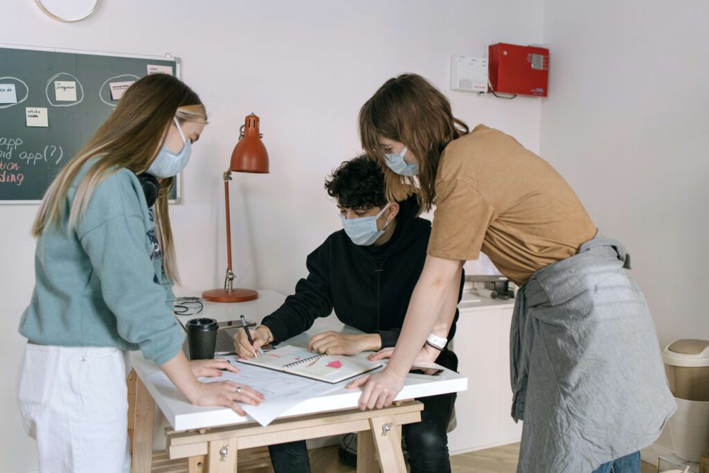 coworkers wearing masks as per their business continuity plan