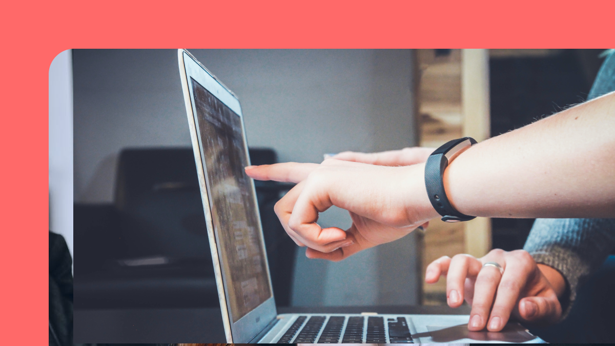 business continuity management: fingers pointing at laptop screen