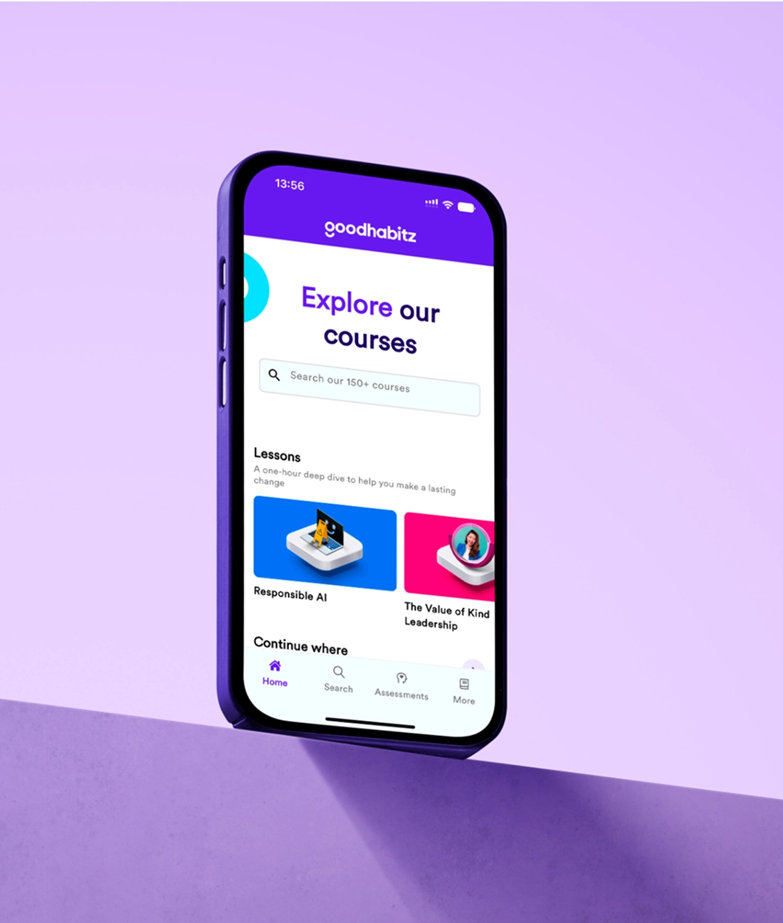 A smartphone displaying the GoodHabitz app interface with a search bar, featured courses, and navigation options, set against a purple gradient background.