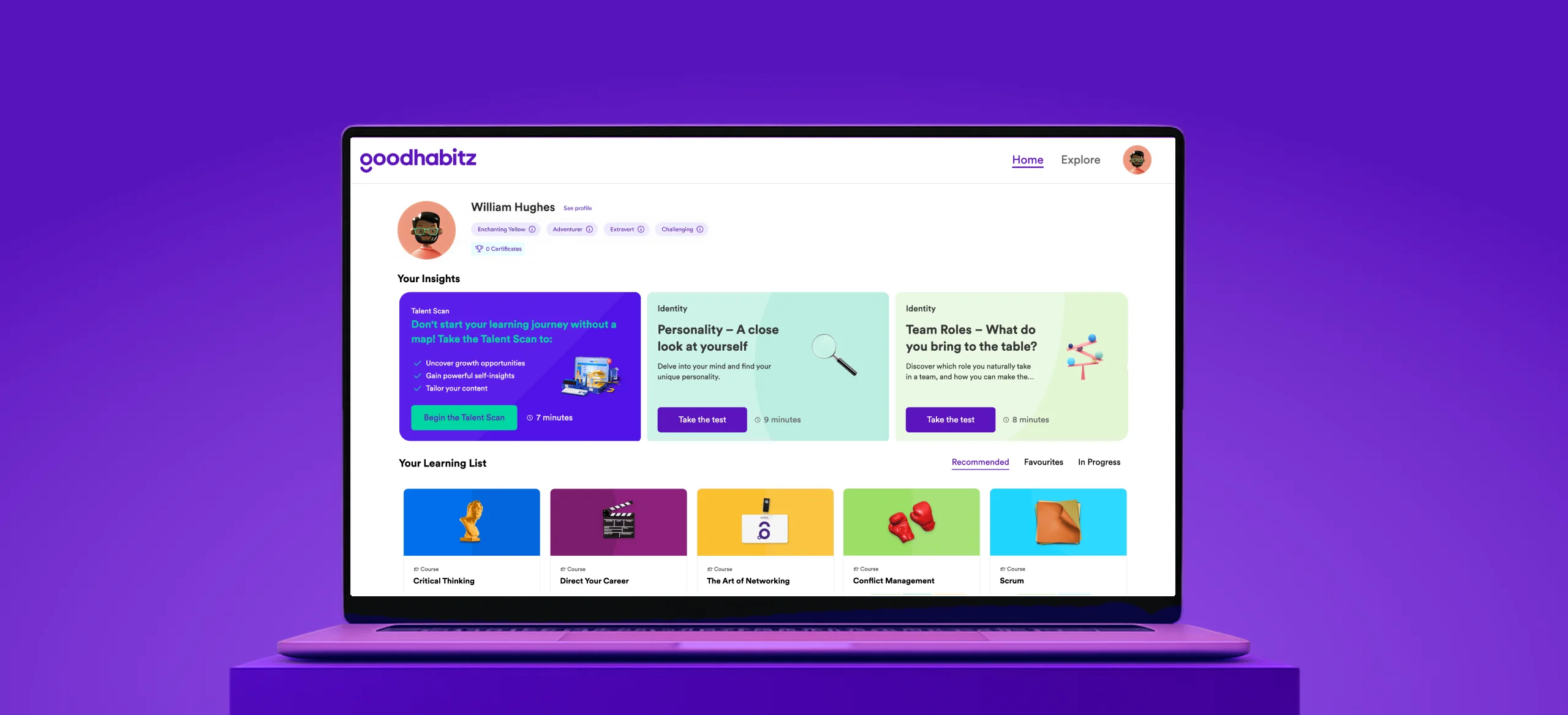 Open laptop displaying the GoodHabitz homepage in English, featuring talent scan options, personality and team roles tests, and a personalised learning list of courses with colourful icons on a purple background.