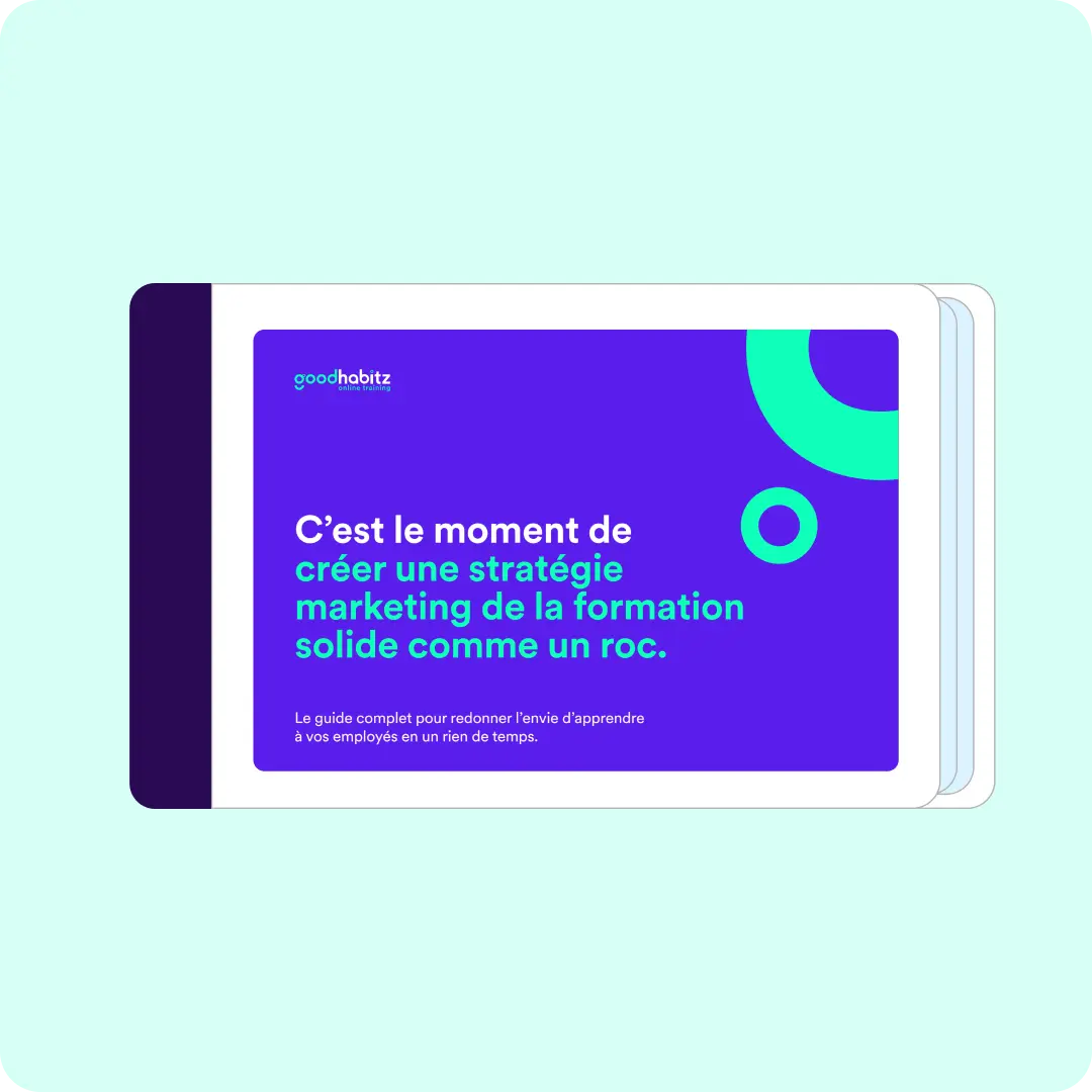 Une couverture de guide numérique de GoodHabitz. Le fond est violet avec des éléments graphiques verts et bleus. Le texte principal dit : "C'est le moment de créer une stratégie marketing de la formation solide comme un roc." 
