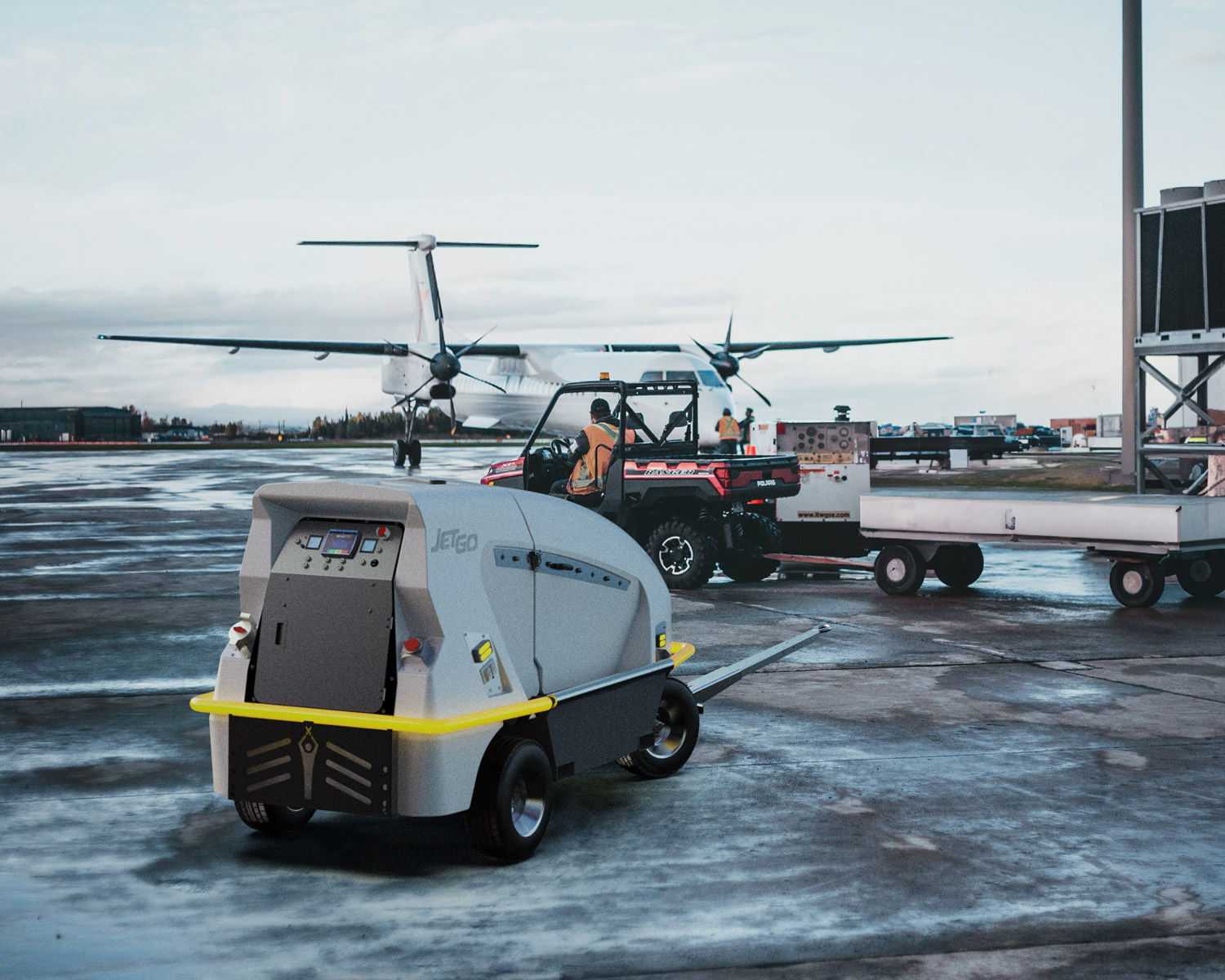 View of Aero Specialties Ground Power Unit on a cloudy rainy day near plane on tarmac