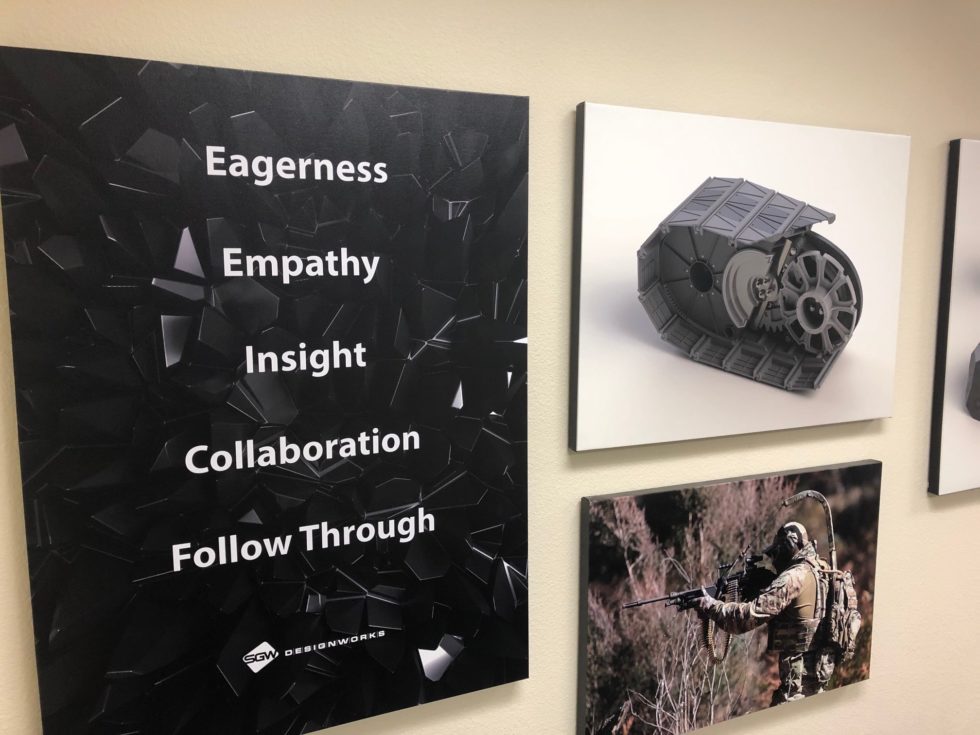 Images on a wall with one listing "Eagerness, Empathy, Insight, Collaboration, and Follow Through"