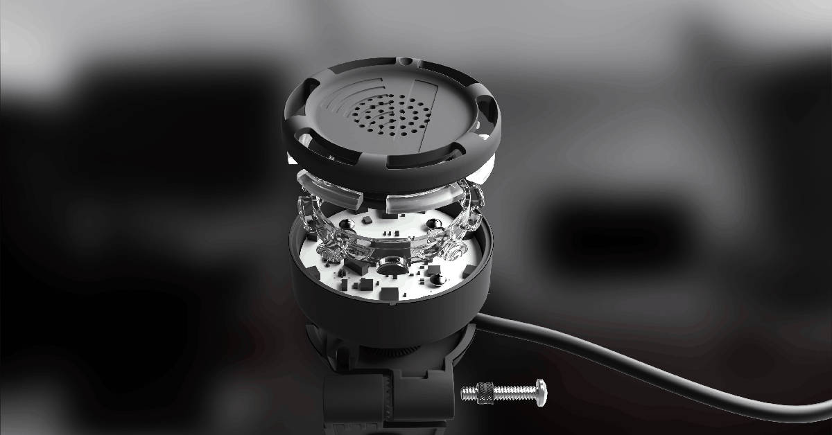 Cutaway rendering of a compact wired device reveals internal circuit parts, transparent supports, and a loose screw.