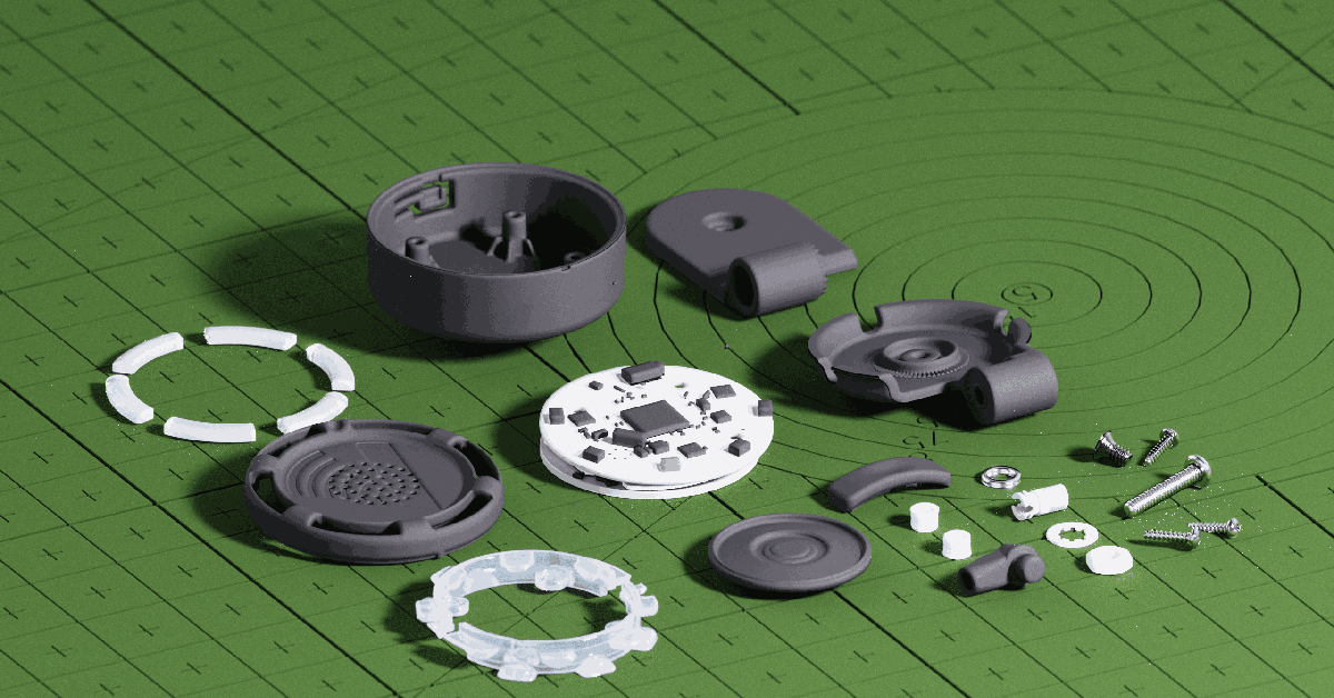 Disassembled compact device parts, circuit board, screws, and gray casing pieces arranged on a green cutting mat.
