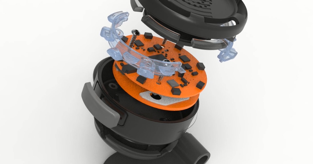 Technical rendering of a black round device separated into layers, exposing orange circuit boards and internal supports.