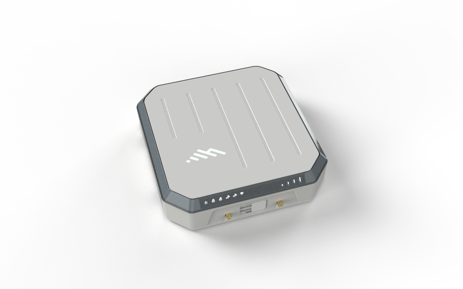 Compact gray electronic device with indicator lights, front connectors, and a grooved top shown on a white background.