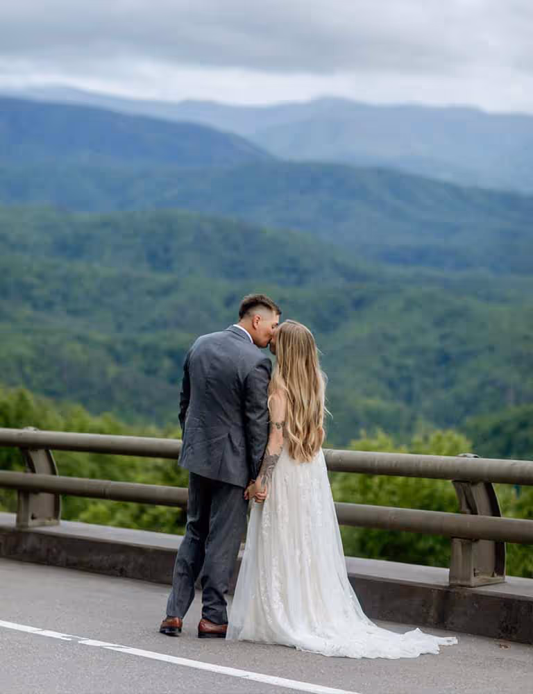 A couple in Foothills Parkway with a view of the Smoky Mountains